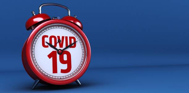Alarm clock with Covid 19 or coronavirus lettering concept. 3d Rendering.
